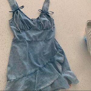Denim mini dress with bow details and ruffle skirt